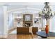 Open living room features a stone fireplace, hardwood floors, a chandelier and built-in cabinets at 1720 Buckhead Valley Ne Ln, Atlanta, GA 30324