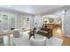 Well-lit open concept living room with hardwood floors, archways and recessed lighting at 1720 Buckhead Valley Ne Ln, Atlanta, GA 30324