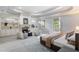 Spacious main bedroom with a fireplace, sitting area, and access to a private balcony at 1720 Buckhead Valley Ne Ln, Atlanta, GA 30324