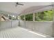Inviting screened porch perfect for enjoying the outdoors with lattice details and ample natural light at 1720 Buckhead Valley Ne Ln, Atlanta, GA 30324