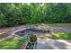 Backyard features a bench swing and fire pit at 20 Spruce Ne St, White, GA 30184