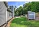 Landscaped backyard with a shed and a patio at 20 Spruce Ne St, White, GA 30184