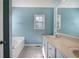 Bathroom with soaking tub, double sink vanity, and plenty of counter space at 20 Spruce Ne St, White, GA 30184