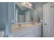 Bathroom with a double sink vanity and a walk-in shower at 20 Spruce Ne St, White, GA 30184