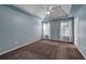 Spacious bedroom with tray ceiling, ceiling fan, and plush carpet at 20 Spruce Ne St, White, GA 30184