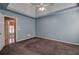 Bedroom with tray ceiling, plush carpet, and natural lighting at 20 Spruce Ne St, White, GA 30184
