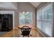 Bright kitchen nook with pendant lighting and lots of natural light from large windows at 20 Spruce Ne St, White, GA 30184