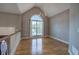 Bright dining area with hardwood floors, a chandelier, and a large arched window at 20 Spruce Ne St, White, GA 30184
