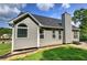 Side view of home with gray siding and manicured lawn at 20 Spruce Ne St, White, GA 30184