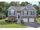 Charming two-story home with a well-manicured lawn, stone accents, shutters and a two car garage at 20 Spruce Ne St, White, GA 30184