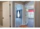 Bright hallway with open doorways leading into carpeted bedrooms, showcasing the home's inviting layout at 20 Spruce Ne St, White, GA 30184