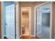 Hallway view featuring a bathroom, bedroom, and neutral color scheme at 20 Spruce Ne St, White, GA 30184