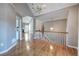 Open floor plan with hardwood flooring throughout, views of kitchen, stairs, and living room at 20 Spruce Ne St, White, GA 30184