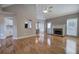Spacious living room with hardwood floors, a fireplace, and abundant natural light at 20 Spruce Ne St, White, GA 30184