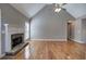 Living room features hardwood flooring, fireplace, and vaulted ceilings at 20 Spruce Ne St, White, GA 30184