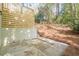 Backyard with small patio area, wood fence/decking, and some greenery at 2729 Ridge Valley Nw Rd, Atlanta, GA 30327