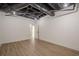 Spacious basement with exposed ceiling, white walls, light wood floors and doorway at 2729 Ridge Valley Nw Rd, Atlanta, GA 30327