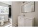 Modern bathroom with sleek vanity, large mirror, and tiled shower at 2729 Ridge Valley Nw Rd, Atlanta, GA 30327