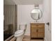 Bathroom featuring modern vanity with round mirror and tiled glass shower enclosure at 2729 Ridge Valley Nw Rd, Atlanta, GA 30327