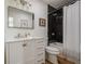 Modern bathroom featuring sleek black tile, a shower with a rainfall showerhead, and stylish vanity at 2729 Ridge Valley Nw Rd, Atlanta, GA 30327