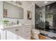 Bathroom with marble shower, modern vanity, and hardwood floors at 2729 Ridge Valley Nw Rd, Atlanta, GA 30327
