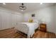 Bright bedroom with hardwood floors, a stylish light fixture, and a comfortable bed at 2729 Ridge Valley Nw Rd, Atlanta, GA 30327