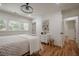 Bright bedroom with hardwood floors, natural light and modern light fixture at 2729 Ridge Valley Nw Rd, Atlanta, GA 30327