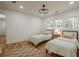 Well-lit bedroom featuring hardwood floors, twin beds and large windows at 2729 Ridge Valley Nw Rd, Atlanta, GA 30327