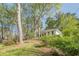 Beautiful white home with mature trees and lush greenery offers a serene and private setting at 2729 Ridge Valley Nw Rd, Atlanta, GA 30327