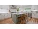 A kitchen featuring white cabinets, stainless steel appliances, and a center island with seating at 2729 Ridge Valley Nw Rd, Atlanta, GA 30327