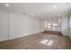 Bright living room featuring wood floors, recessed lighting, and a set of glass French doors at 2729 Ridge Valley Nw Rd, Atlanta, GA 30327