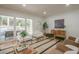 Bright living room featuring sliding glass doors to the outdoor space, with stylish seating at 2729 Ridge Valley Nw Rd, Atlanta, GA 30327