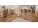 Open-concept living room with hardwood floors, neutral furniture, and lots of natural light at 2729 Ridge Valley Nw Rd, Atlanta, GA 30327