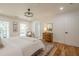 Bright and airy main bedroom featuring hardwood floors, neutral tones, and two windows letting in natural light at 2729 Ridge Valley Nw Rd, Atlanta, GA 30327