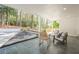 Covered patio featuring stone floor, comfortable seating, and a view of the back yard at 2729 Ridge Valley Nw Rd, Atlanta, GA 30327