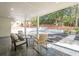 Covered patio with stone pavers, comfortable seating, and view of backyard and landscape at 2729 Ridge Valley Nw Rd, Atlanta, GA 30327