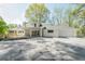 Spacious backyard with an expansive deck, an outdoor living area, and an attached two car garage at 2729 Ridge Valley Nw Rd, Atlanta, GA 30327