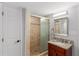 Updated bathroom features a glass enclosed shower, granite countertop and modern vanity at 3307 Pointe Bleue Ct, Decatur, GA 30034