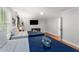 Inviting bedroom featuring two beds, neutral walls, wood flooring and an entertainment center at 3307 Pointe Bleue Ct, Decatur, GA 30034