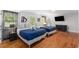 Spacious bedroom featuring two beds, wood floors, tv, and neutral paint, perfect for relaxation at 3307 Pointe Bleue Ct, Decatur, GA 30034