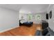 Bright bedroom with hardwood floors, and large windows that provide natural light at 3307 Pointe Bleue Ct, Decatur, GA 30034