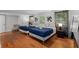 Cozy bedroom featuring hardwood floors, two beds with fresh linens and soft window lighting at 3307 Pointe Bleue Ct, Decatur, GA 30034