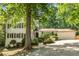 Beautiful home with a well-maintained lawn, mature trees, and inviting curb appeal at 3307 Pointe Bleue Ct, Decatur, GA 30034