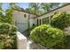 Home exterior with lush greenery, a charming entrance, and beautiful architectural details at 3307 Pointe Bleue Ct, Decatur, GA 30034
