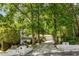 Charming two-story home with a manicured lawn and mature trees providing ample shade at 3307 Pointe Bleue Ct, Decatur, GA 30034