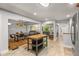 Open concept kitchen with a breakfast bar that flows into the dining and living areas at 3307 Pointe Bleue Ct, Decatur, GA 30034