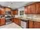 Well-appointed kitchen featuring stainless steel appliances, granite countertops, and ample cabinet space at 3307 Pointe Bleue Ct, Decatur, GA 30034