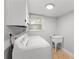 Bright laundry room featuring a washer, dryer, and utility sink at 3307 Pointe Bleue Ct, Decatur, GA 30034
