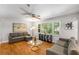 Comfortable living room featuring hardwood floors, neutral paint, and plentiful seating at 3307 Pointe Bleue Ct, Decatur, GA 30034
