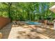 Beautiful backyard pool with lounge chairs and lush greenery at 3307 Pointe Bleue Ct, Decatur, GA 30034